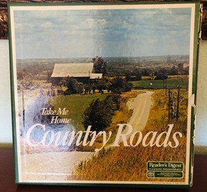 lot 106 image: READERs DIGEST TAKE MY HOME COUNTRY ROADS - SET OF 7 RECORDS