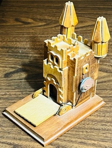 lot 49 image: WOODEN CASTLE MUSIC BOX  RETRACTABLE DRAW BRIDGE - PLAYS CAMELOT