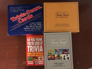 lot 130 image: 3 TRIVIA PURSUIT GAMES &amp 1 TRIVIA BOOK