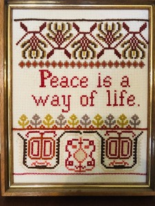 lot 168 image: FRAMED NEEDLE-POINT PEACE IS A WAY OF LIFE 19x15