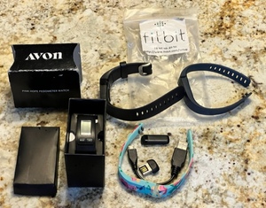lot 290 image: FITBIT LOT wAVON PINK HOPE PEDOMETER WATCH