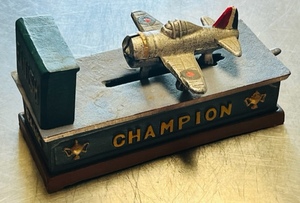 lot 8 image: VINTAGE CAST IRON CHAMPION BRITISH FIGHTER PLANE BANK