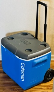 lot 58 image: PORTABLE COLEMAN COOLER wWHEELS &amp EXTENDABLE HANDLE