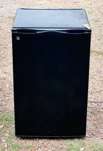 lot 42 image: Black General Electric ( GE ) Mini-Fridge