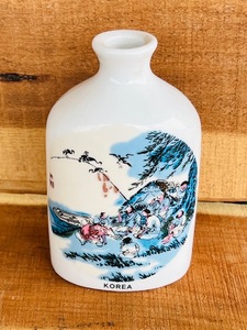 lot 82 image: Vintage 5 Bottle from Korea With Fisherman Sharing Meal