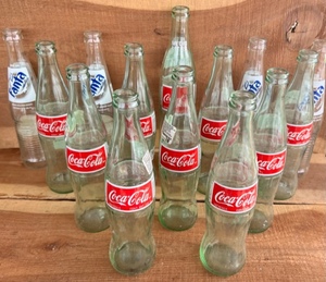 lot 199 image: Fourteen Glass Coca-Cola &amp Fanta Bottles