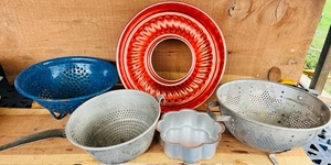 lot 303 image: Two Vintage Aluminum Collanders and One Blue Metal W Mirro 11 Cup Jello Mold & 6x2 Wilton Cake Pan
