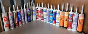 lot 31 image: LARGE LOT OF ASSORTED ADHESIVES AND CAULKINGS AS SHOWN.