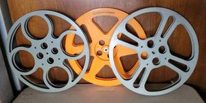 lot 44 image: LOT OF 3 VINTAGE MOVIE FILM REELS AS SHOWN. TWO METAL AND ONE PLASTIC. (SOLD 3 X THE MONEY)