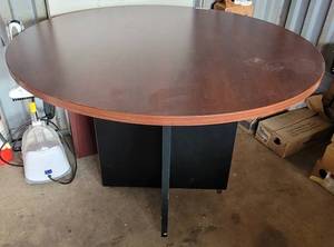 lot 92 image: ROUND WOODEN OFFICE TABLE IN STYLE SHOWN.