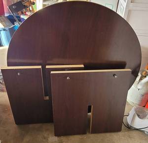 lot 97 image: ROUND WOODEN OFFICE TABLE IN STYLE SHOWN. DISASSEMBLED.