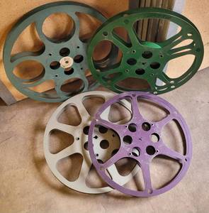 lot 125 image: LOT OF 4 VINTAGE METAL MOVIE FILM REELS AS SHOWN. (SOLD 4 X THE MONEY)