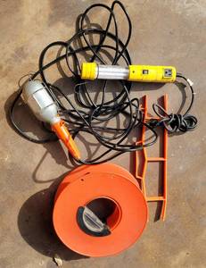 lot 138 image: LIGHTS AND EXTENSION CORD HOLDERS AS SHOWN.