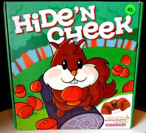 lot 42 image: New in Box Hide N Cheek Board Game by Big G Creative
