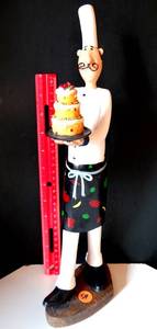 lot 54 image: TALL THIN PASTRY CHEF WITH 3 LAYER CAKE