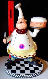 lot 62 image: OVERSIZED PASTRY CHEF ON BLACK & WHITE CHECKERED BASE (RESIN)