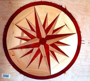 lot 202 image: AMAZING HANDMADE - LAZER CUT OUT COMPASS STAR WITH VARIOUS WOODS