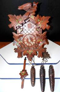 lot 241 image: DECORATIVE WOODEN COOCOO CLOCK WITH WEIGHTS & PENDULUM - UNTESTED