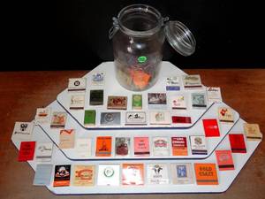 lot 252 image: VINTAGE COLLECTION OF MATCH BOOKS STORED IN AIRTIGHT GLASS BOTTLE