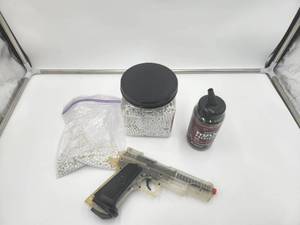 lot 23 image: Air soft pistol, with extra ammo.