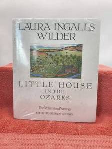 lot 31 image: Little House in the Ozarks book by Laura Ingalls Wilder - never opened (plastic wrapped)