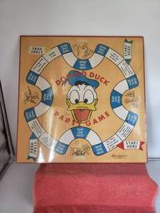 lot 35 image: Vintage Donald Duck game board - plastic wrapped and on backboard
