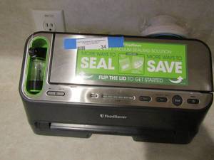 lot 34 image: Food saver has all pieces works well