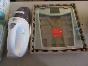 lot 36 image: B&D hand held vacuum and NEW Health O Meter scale