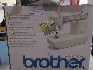 lot 45 image: Brothers table top sewing machine original box with paper work