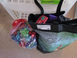 lot 46 image: Christmas lot- bows, bags, boxes, and some decor