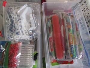 lot 101 image: Lot of toothbrushes, travel mini toothbrush floss etc.