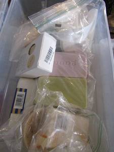lot 103 image: 2 small tubs of travel size soap and lotion