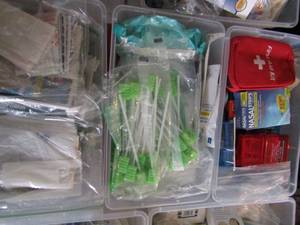 lot 104 image: 3 small tubs of bandages, thermometer, ointment