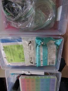 lot 111 image: Nasal cannula, pill cutter, weekly med boxes, mouth sponges