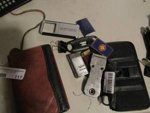 lot 117 image: Lot- lighters, lighted magnifying glass, leather wallet and bottle openers