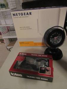 lot 196 image: Netgear Wi-Fi box, table clock, talking tire gauge