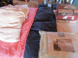 lot 205 image: 2 hospital blankets, set of coverall pants large unisex, Westbend cordless iron, Hotel 21 brand queen size shames
