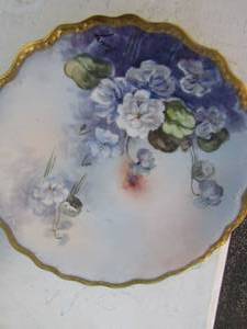 lot 34 image: Glass S&P shakers, sugar  containor,  3 oilvinegar cruets,  and 4 flower plates  ( 1 is LIMOGES, 3 ARE CT)