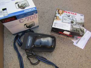 lot 39 image: Pentax optio 57 camera in box,   Olympus stylus camera ,   Camedia C-7000 ultra zoom camera plus  2 camera bags