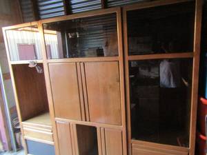 lot 3 image: 3 piece Entertainment center with top lighting 78x90x19 has 3 glass top storage compartments, 2 sets of doors with TV DVD storage, Bottom in speakers
