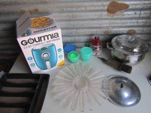 lot 101 image: Gourmia Air fryer in box, flatwear tray, pot with lid, egg poacher, glass serving platter and candy dish