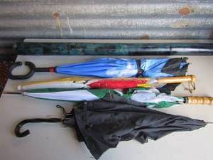 lot 117 image: Blue rain stick and 4 different size umbrellas