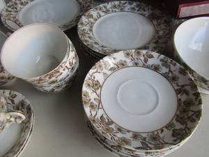 lot 127 image: Havilland & Limoges CHINA Set, 1 dinner plate, 6 tea cups, 5 saucers,  creamersugar set, Tea POT,  gravy boat  2 small ROYAL  Worchester CONDIMENT with lids,  Limited edition Norman Rockwell bell  Doctor and Doll