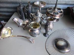 lot 129 image: Silver plated tea POTS, COFFEE POTS, Creamer sugar sets, deviled egg plate, LADLE,  basket