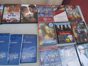 lot 141 image: Math books and DVDs The lucky ones, Christmas for a dollar,  and lots more