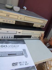lot 152 image: Samsung DVDVHS combo with remote and Govideo sonic blue DVDVHS comes with remote