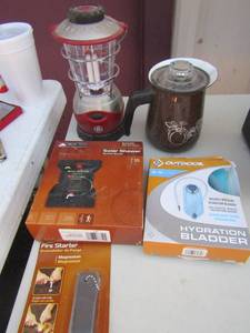 lot 154 image: Camping- NEW fire starter NEW Ozark trail 5 gallon  solar shower, 2.0 hydration bladder, GE battery operated lantern, Brown camping coffee pot.
