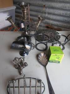 lot 156 image: Silver plated lot- tea strainer, napkin holder, candle stick, gravy boat