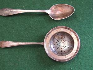 lot 190 image: Sterling silver Table spoon RLB Rodgers Lunt Bowden Pat.112805 42gms.   Tea strainer marked Sterling X100  7L  3 W  50 gms.