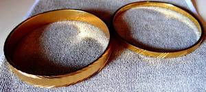 lot 27 image: LOT OF 2 - MONET GOLD TONE BANGLE BRACELETS